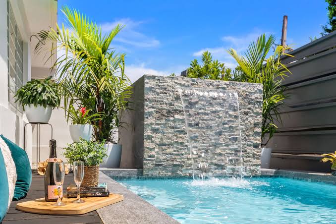 High So Club — pool and waterfall